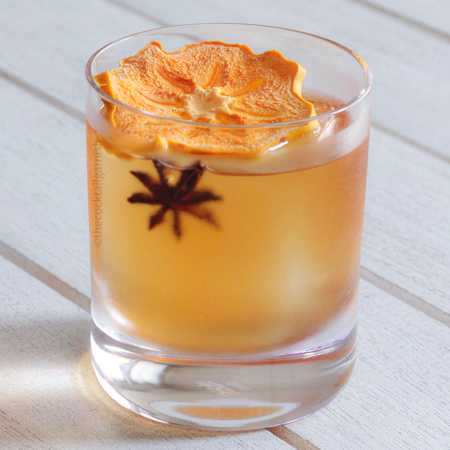 Dehydrated Persimmon Cocktail Garnishes in Whiskey Cocktail