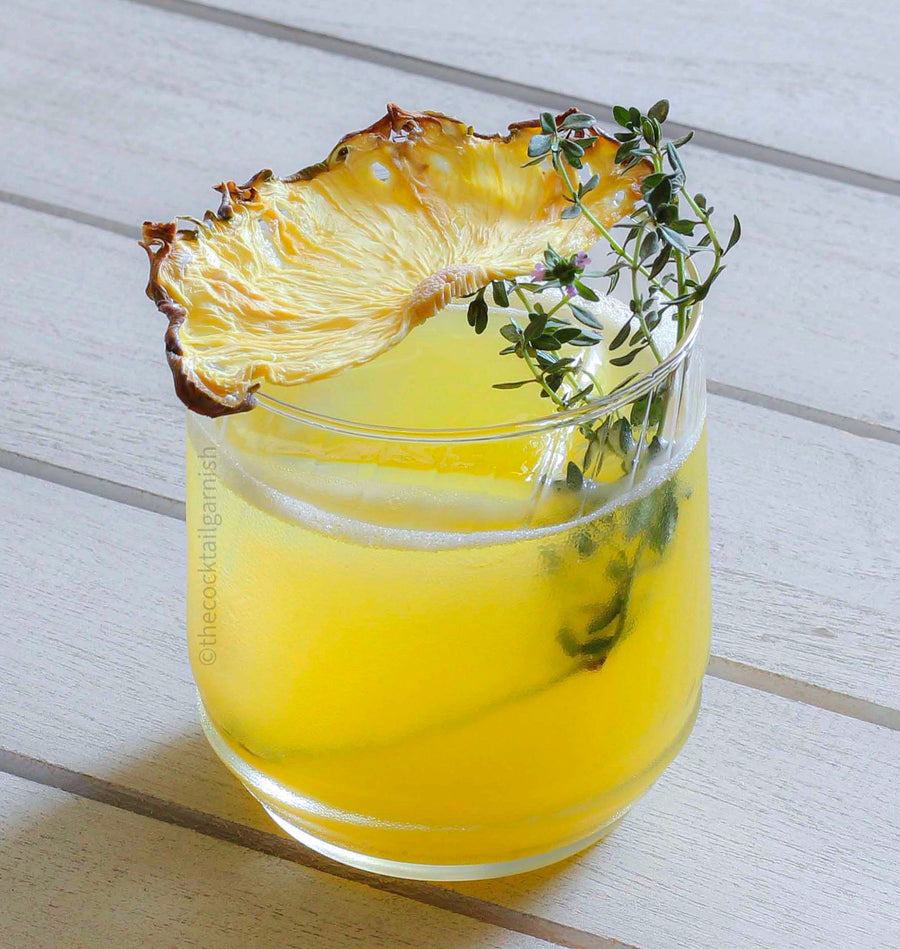 Dehydrated Pineapple Cocktail Garnish in Rum Cocktail
