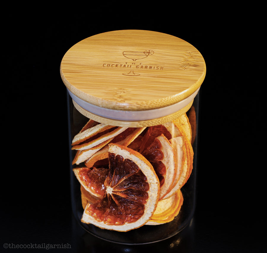 Eco friendly glass jar in an airtight bamboo lid for all your dried goods! Beautifully dehydrated Red Dragon Fruit wheels for your cocktails, mocktails and teas. Grown locally in Southern California, handcrafted and made in the USA. Find them at The Cocktail Garnish at www.thecocktailgarnish.com. Orange navels, cara caras, clementines, lemons, limes and grapefruit. Premium dehydrated citrus and other seasonal garnishes for all occasions and beverages